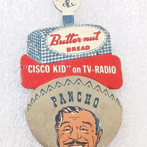 May include: Vintage advertising piece for Butter-nut Bread featuring "Cisco Kid" on TV-Radio and a smiling cartoon of Pancho. The top section has a blue and white checkered pattern. The piece is from Green Bock Co., Chicago.