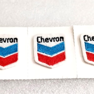 May include: Five Chevron logo patches. Each patch features a white border, a blue and red chevron design, and the word "Chevron" in black text.