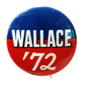 May include: A round button with a blue top and red bottom. The word "WALLACE" is in white block letters, and the number "'72" is in white cursive script.