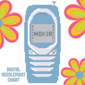 May include: A pixel art digital needlepoint chart featuring a light blue mobile phone with a gray screen displaying the text NOKIA. The phone has white buttons and a small antenna. Three large flowers with pink petals and lime green centers surround the phone.