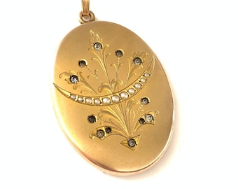 May include: A gold oval locket with a floral design and a crescent moon with pearl accents.