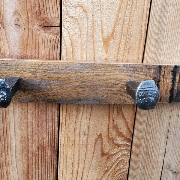 Oak whiskey barrel stave coat rack with 2 railroad spikes