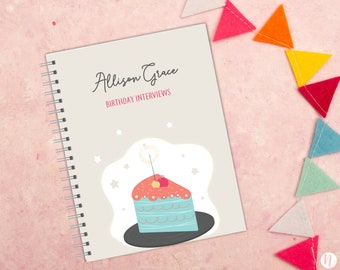 May include: A gray spiral bound notebook with the text "Allison Grace Birthday Interviews" and a cartoon illustration of a slice of cake with a cherry on top.