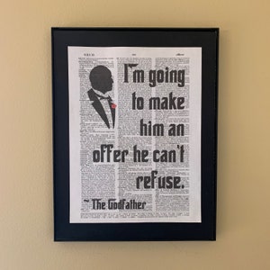 May include: A black and white image of a man in a suit with a red rose in his lapel. The text "I'm going to make him an offer he can't refuse. The Godfather" is printed on a vintage dictionary page.
