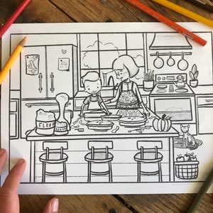 May include: A black and white coloring page of a kitchen scene with a woman and a child making pies. There are bags of flour and sugar on the counter, a cat sitting on the floor, and a basket of apples.