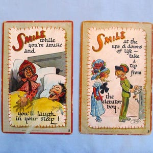 May include: Two vintage postcards with humorous illustrations. One shows a person in bed with the text "Smile while you're awake and you'll laugh in your sleep!" The other depicts a scene with the text "Smile at the ups & downs of life - take a tip from the elevator boy."