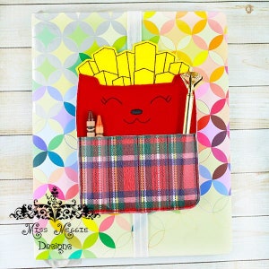 May include: A red felt pencil pouch shaped like a cartoon french fry with a plaid pocket. The pouch has a smiling face and is holding two crayons and a gold pen.