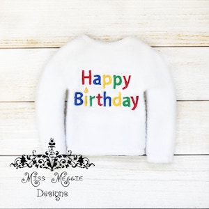 May include: White elf-sized sweater with the words "Happy Birthday" embroidered in colourful letters.