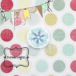 May include: A white circle with a blue snowflake design on a white background with colorful polka dots. The text "kmdesigns" is in a black frame.