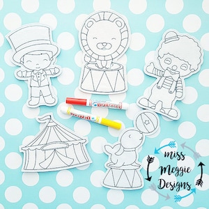 May include: Five black and white outline images of circus performers and a tent. The images are on a blue background with white polka dots. The images include a ringmaster, a lion, a clown, a seal, and a tent. The text "miss meggie designs" is in the lower right corner of the image.