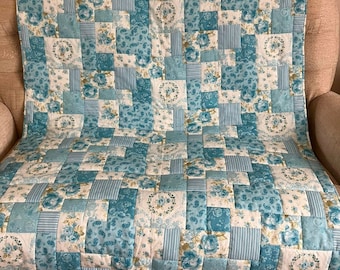 Handmade quilt NOT patchwork, pretty blue vintage themed fabric quilted onto a matching blue fleece. blue and white vintage patterned fabric