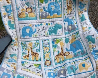 handmade blue themed quilt for a blue nursery, safari themed quilt quilted on matching sand yellow fleece, baby gift, baby shower baby boy