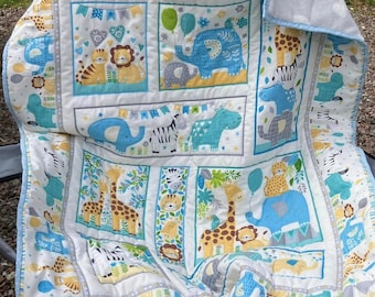 handmade blue themed quilt for a blue nursery, safari themed quilt quilted onto a soft grey and white heart fleece, baby gift, baby boy gift
