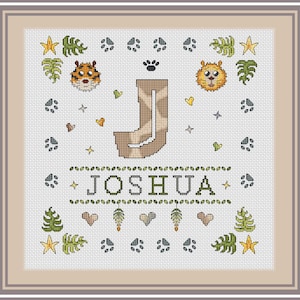 May include: Cross-stitch design with the name "JOSHUA" in green, and a giraffe-patterned "J". The design includes animal faces, paw prints, stars, and hearts, framed in neutral tones. A decorative piece suitable for a child's room.