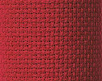 May include: Red Aida cloth, a type of fabric used for cross-stitch embroidery.