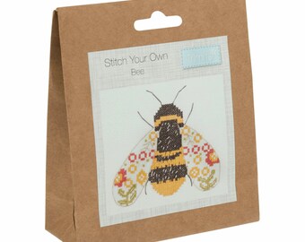 May include: A brown paper bag with a white label that says "Stitch Your Own Bee" and a small blue label that says "Trimills". The label has a picture of a bee with yellow and black stripes and wings with red and yellow flowers.