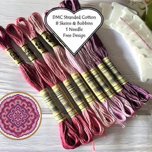 May include: DMC Stranded Cotton embroidery floss kit with 8 skeins of pink and purple floss, 1 needle, and bobbins. The kit includes a free design for a pink and purple mandala.