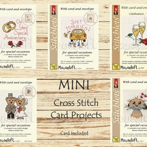 May include: A set of six mini cross stitch card projects with card and envelope included. The designs include a wedding ring, a car with "Just Married!" on it, a champagne glass, a couple of bears, and a meerkat with a rose. Each design is labeled "Stitchlets" and "Mouseloft".