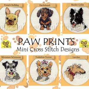 May include: A set of 8 mini cross stitch designs featuring different dog breeds. The designs include a French Bulldog, Dachshund, Border Collie, Miniature Schnauzer, Yorkshire Terrier, Lurcher, and two other breeds. The designs are all in a circular format and are surrounded by a brown paw print pattern.