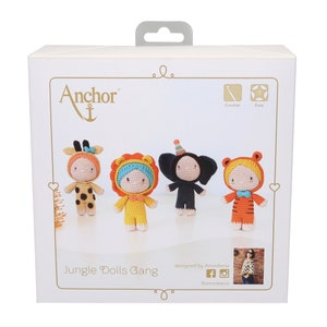 May include: A box of crochet patterns for making four jungle animal dolls. The dolls are a giraffe, lion, elephant, and tiger. The box is white with a gold border and the text "Anchor" and "Jungle Dolls Gang" on the front. The box also includes the text "designed by Ameskeria" and a social media icon.