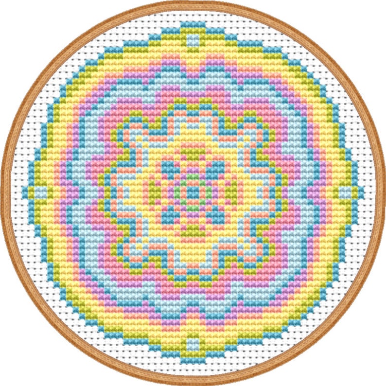 May include: A colorful circular cross-stitch pattern with a yellow, green, blue, and pink color scheme. The pattern is framed in a wooden hoop.
