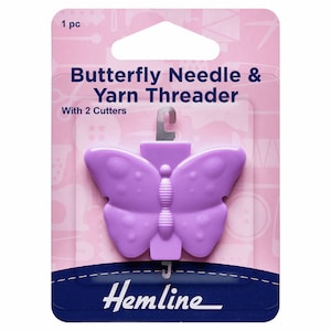 May include: A lilac butterfly-shaped needle and yarn threader with two cutters, packaged on a pink and white card. The text "Butterfly Needle & Yarn Threader" and "Hemline" are printed on the packaging.