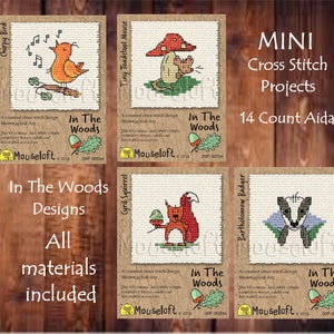 May include: Four mini cross stitch patterns featuring woodland animals. The patterns are titled "Chirpy Bird", "Tiny Toadstool Mouse", "Cyril Squirrel", and "Bartholomew Badger". Each pattern includes the text "In The Woods" and the copyright information "Mouseloft © 2015".