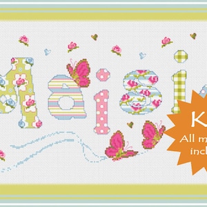 May include: Cross stitch kit featuring the name "Maisie" in colourful patterned letters with butterflies and flowers. The kit includes all materials needed.