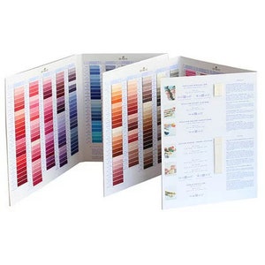 May include: A DMC embroidery floss colour chart with multiple pages showing a variety of colours. The chart includes a DMC logo and text about the floss.