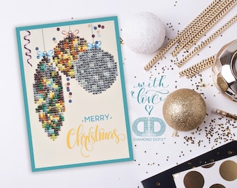 May include: A Christmas card with a blue border featuring three colorful ornaments with a "Merry Christmas" message and the text "with love" and "Diamond Dotz".