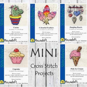 May include: A set of six mini cross stitch patterns featuring a cactus, colourful feathers, dangling hearts, a cupcake, pink ice cream, and the text "MINI Cross Stitch Projects".
