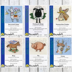 May include: Six cross-stitch patterns featuring various animals, including a llama, sheep, donkey, pony, pig, and llama. Each pattern is labeled with the animal's name and includes the text "Mouseloft" and a copyright date.