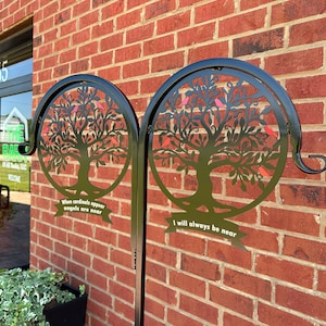 May include: Two black metal tree of life silhouettes with red cardinals on a brick wall. The left side reads "When cardinals appear angels are near". The right side reads "I will always be near".