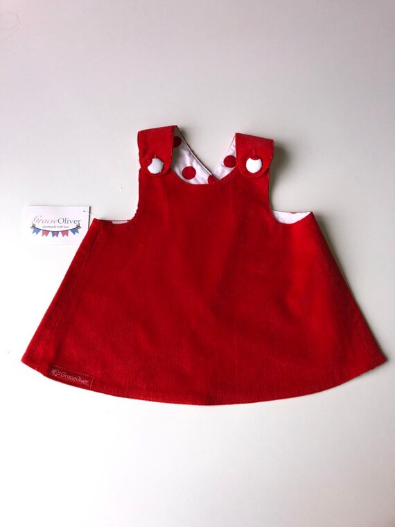 red pinafore dress baby