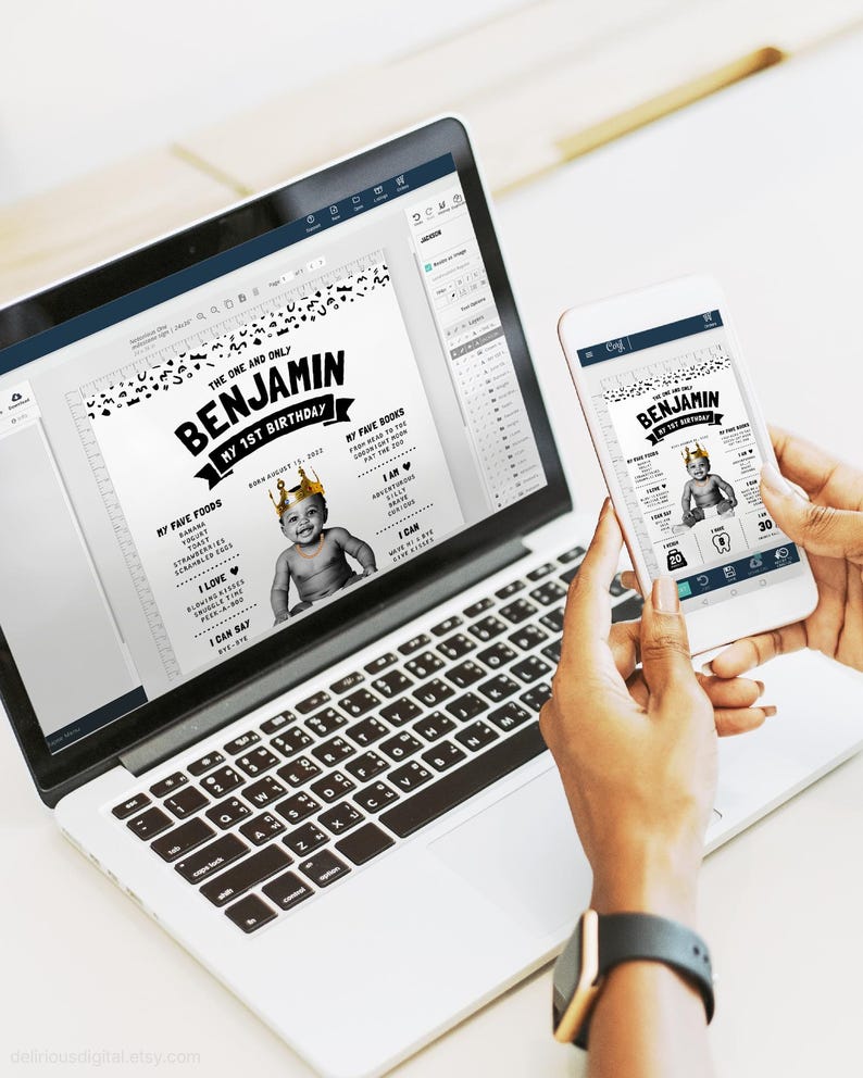 May include: A laptop and a smartphone displaying a digital birthday milestone poster for a child named Benjamin. The poster features a black and white leopard print border, a photo of a baby wearing a gold crown, and text detailing birthday facts.