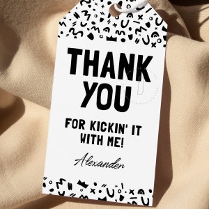 May include: White thank you tag with black text and a black and white geometric pattern border. The text reads "Thank You for Kickin' It With Me! Alexander".