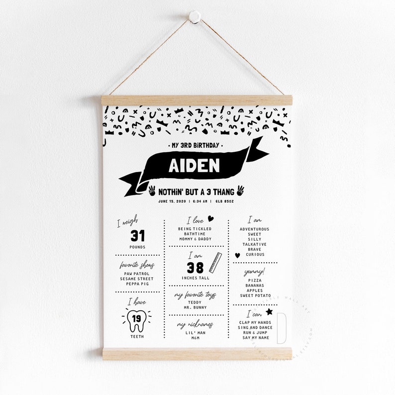 May include: Black and white printable birthday chart for a 3-year-old boy named Aiden. The chart includes details like his weight (31 pounds), height (38 inches), favorite things, and skills. The text "Nothin' but a 3 thang" is featured at the top.