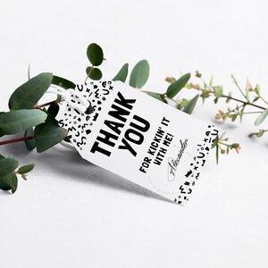 May include: Black and white thank you gift tag with the text "Thank You for kickin' it with me!" and the name "Alexander" in a circle. The tag is decorated with a black and white pattern of abstract shapes.