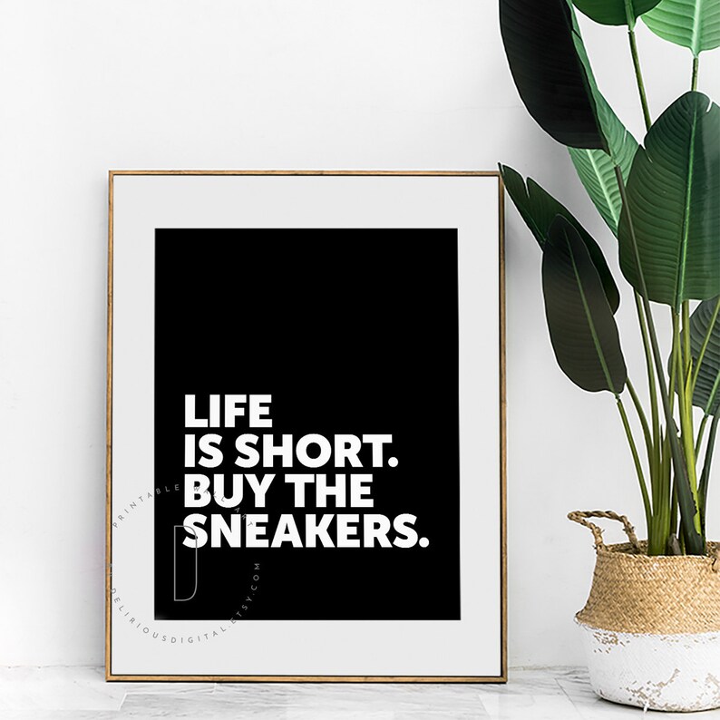 May include: Black and white printable wall art with the text "Life is short. Buy the sneakers."