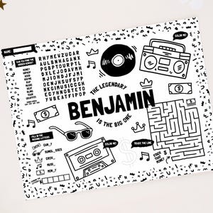 May include: A black and white activity sheet featuring the name BENJAMIN, a word search, a maze, and illustrations of a vinyl record, boombox, cassette tape, and sunglasses. The text reads THE LEGENDARY BENJAMIN IS THE BIG ONE with various prompts.