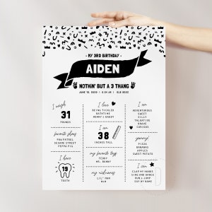 May include: Black and white birthday poster with the name Aiden and the text "Nothin' but a 3 thang". The poster includes details about the child's age, weight, height, favorite things, and abilities.