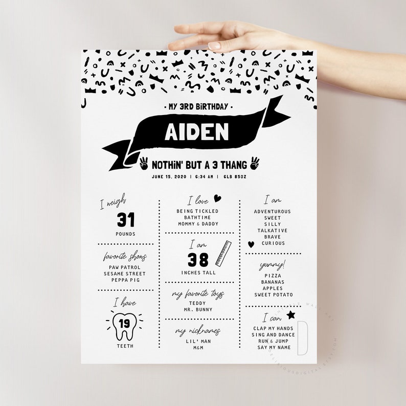 May include: Black and white birthday poster with the name Aiden and the text "Nothin' but a 3 thang". The poster includes details about the child's age, weight, height, favorite things, and abilities.