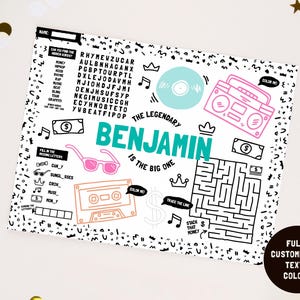 May include: A white activity placemat featuring black line art, including a word search, a maze, and fill-in-the-blank games. The design includes a teal name 'BENJAMIN', a pink boombox, pink sunglasses, an orange cassette tape, and money icons.