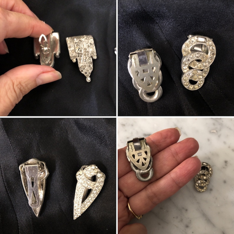 May include: Four vintage silver tone rhinestone dress clips. Two clips are shaped like a teardrop with a pointed bottom. The other two clips are shaped like a heart with a pointed bottom. All clips have a silver tone metal backing.