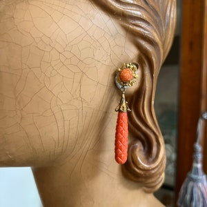 Antique carved coral convertible drop earrings on 9ct yellow gold.