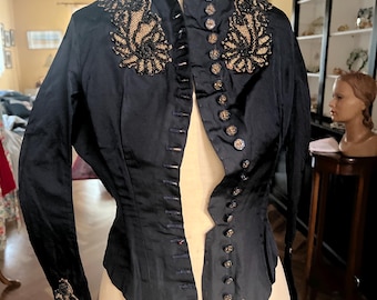 Early 1900s hand stitched silk faille jacket with steel cut and marcasite buttons, and jet beaded features.
