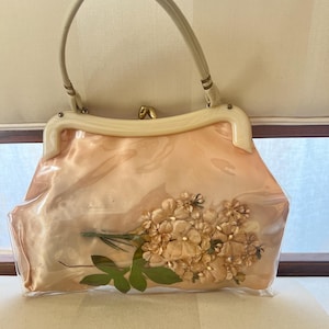 Cutest 1950s celluloid plastic and satin handbag