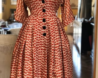 1940s silk fit and flare novelty print dress with large carved buttons