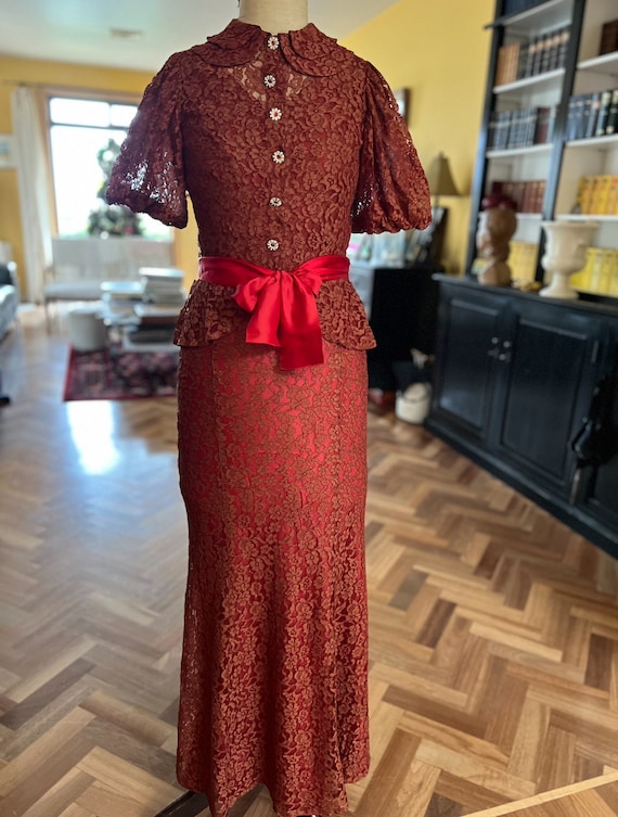 red lace dress with jacket LOOK 29 An absolutely spectacular total red look that embodies passion,  confidence and modern elegance. The jacket with accent shoulders adds  structure and depth to the look, while the lace dress emphasizes