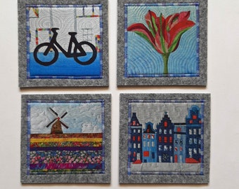 set of 4 coasters, bike, tulip, houses and windmill, light grey